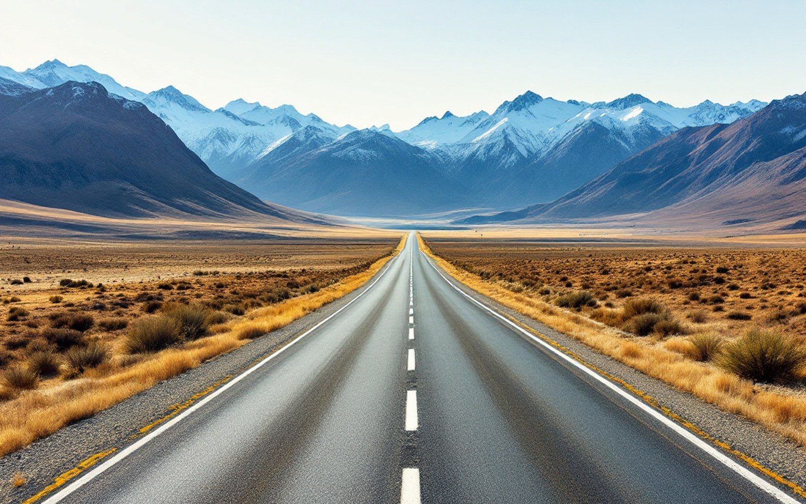 An empty motorway running through dry open country
